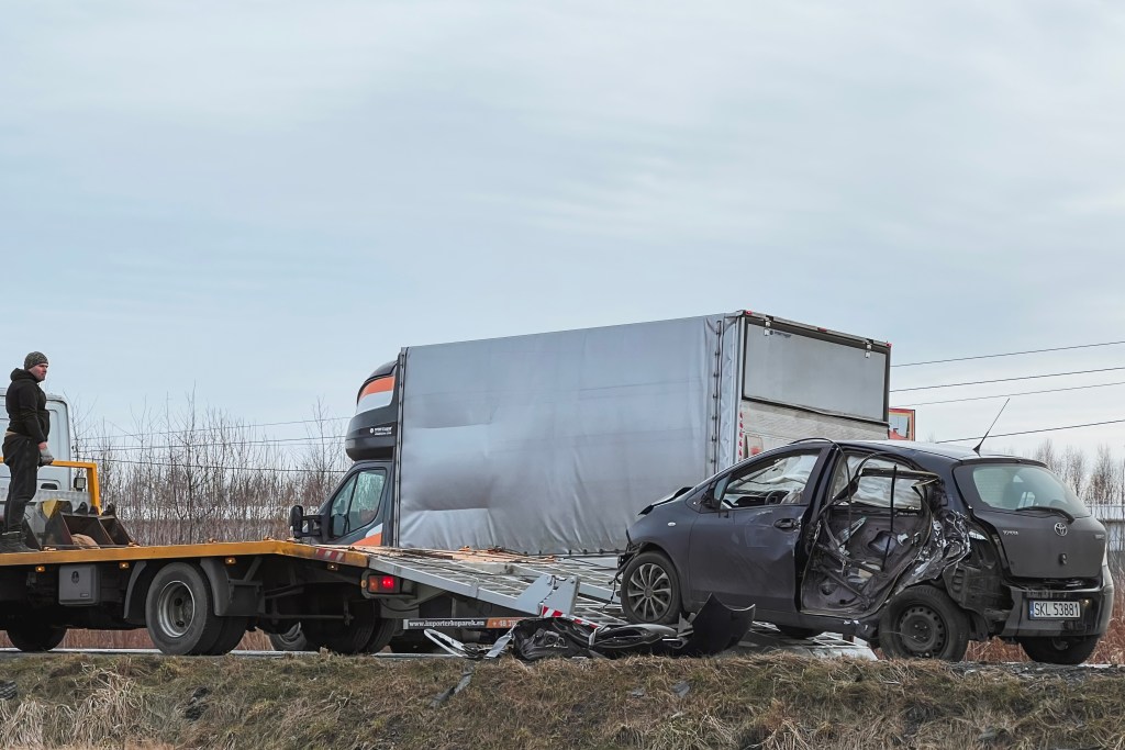 02022024 poland europe tbone car accident side crashed modern family car tow truck with broken car road tow truck loading car highway road accident site