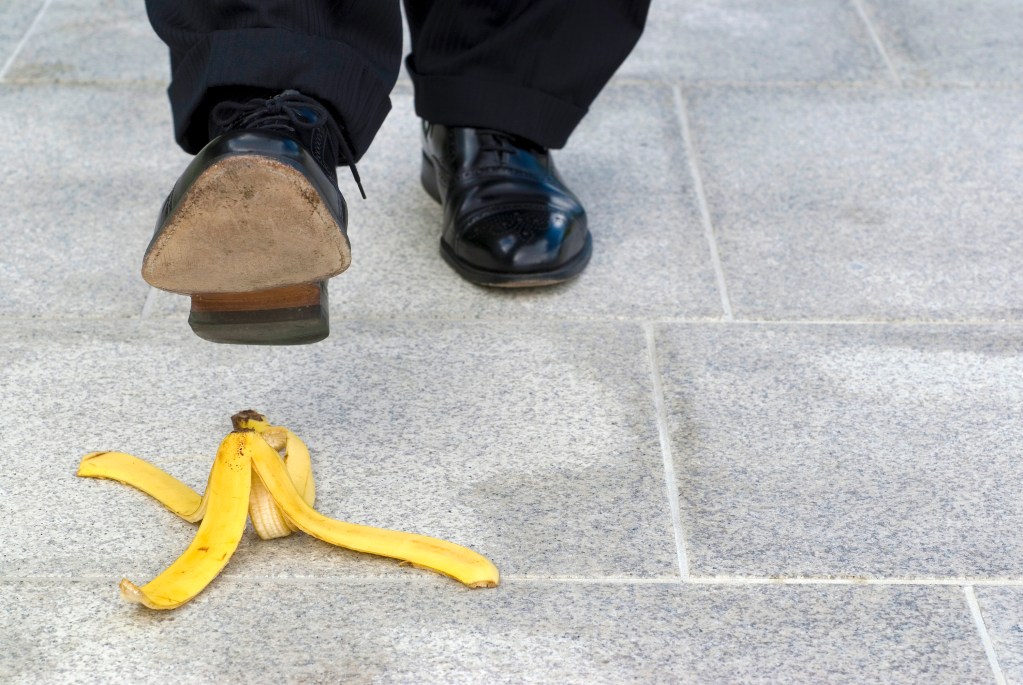 man is going step banana peel