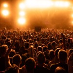 back view crowd fans watching live performance music concert night copy space
