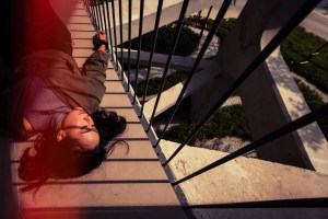 high angle portrait woman relaxing railing