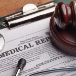 medical form with words medical malpractice gavel
