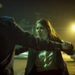 woman defending herself from physical assault by man dark quite parking lot