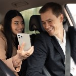 woman talking with taxi driver car